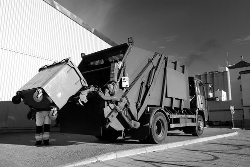 View of skip hire van parked in a suburban Coney Hall street